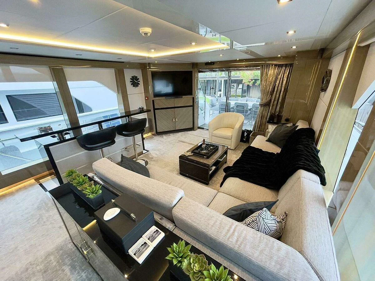 a living room with a large window aboard SCORPIO II Yacht for Sale