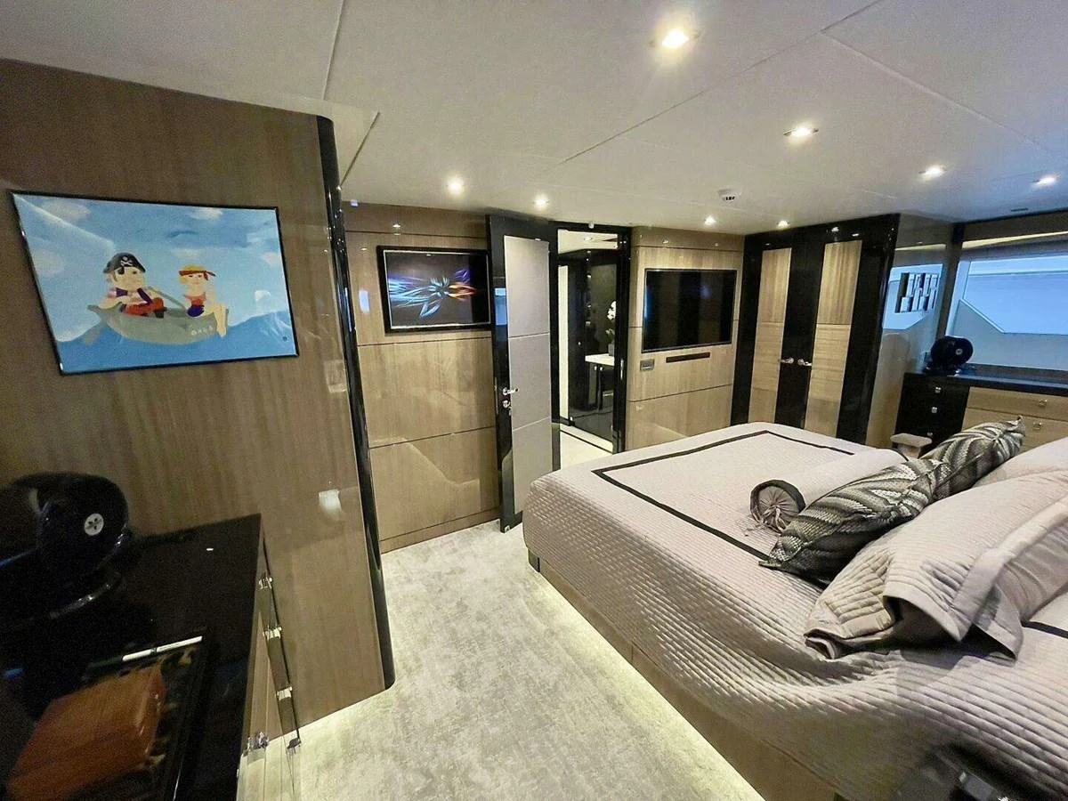 a bedroom with a large mirror aboard SCORPIO II Yacht for Sale