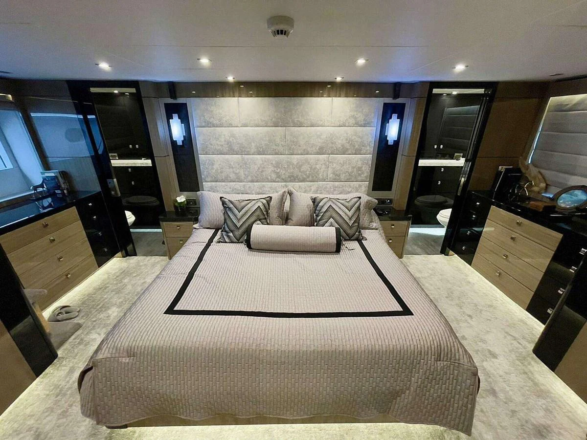 a room with a bed and a desk aboard SCORPIO II Yacht for Sale
