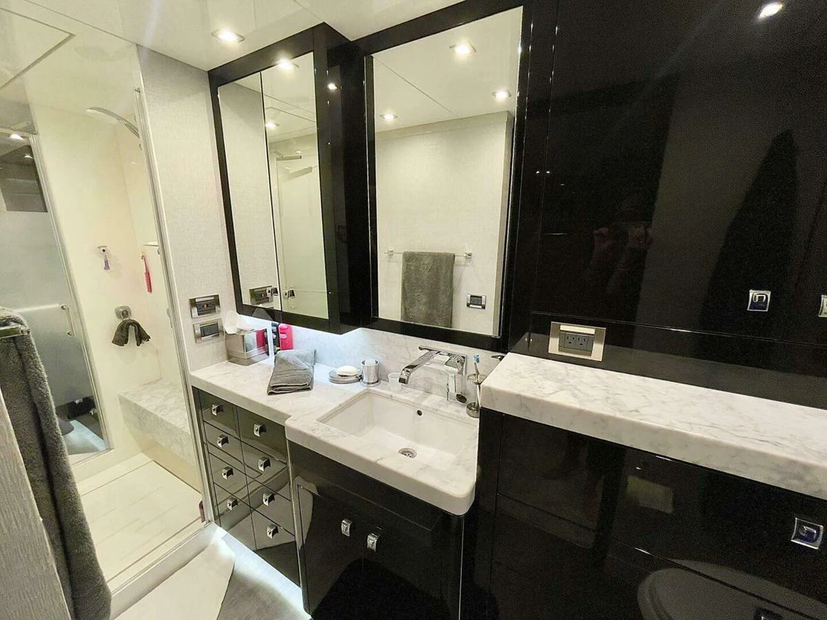 a bathroom with sinks and mirrors aboard SCORPIO II Yacht for Sale