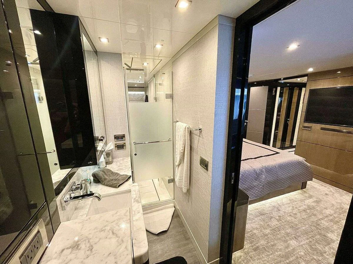 a bathroom with a large mirror aboard SCORPIO II Yacht for Sale