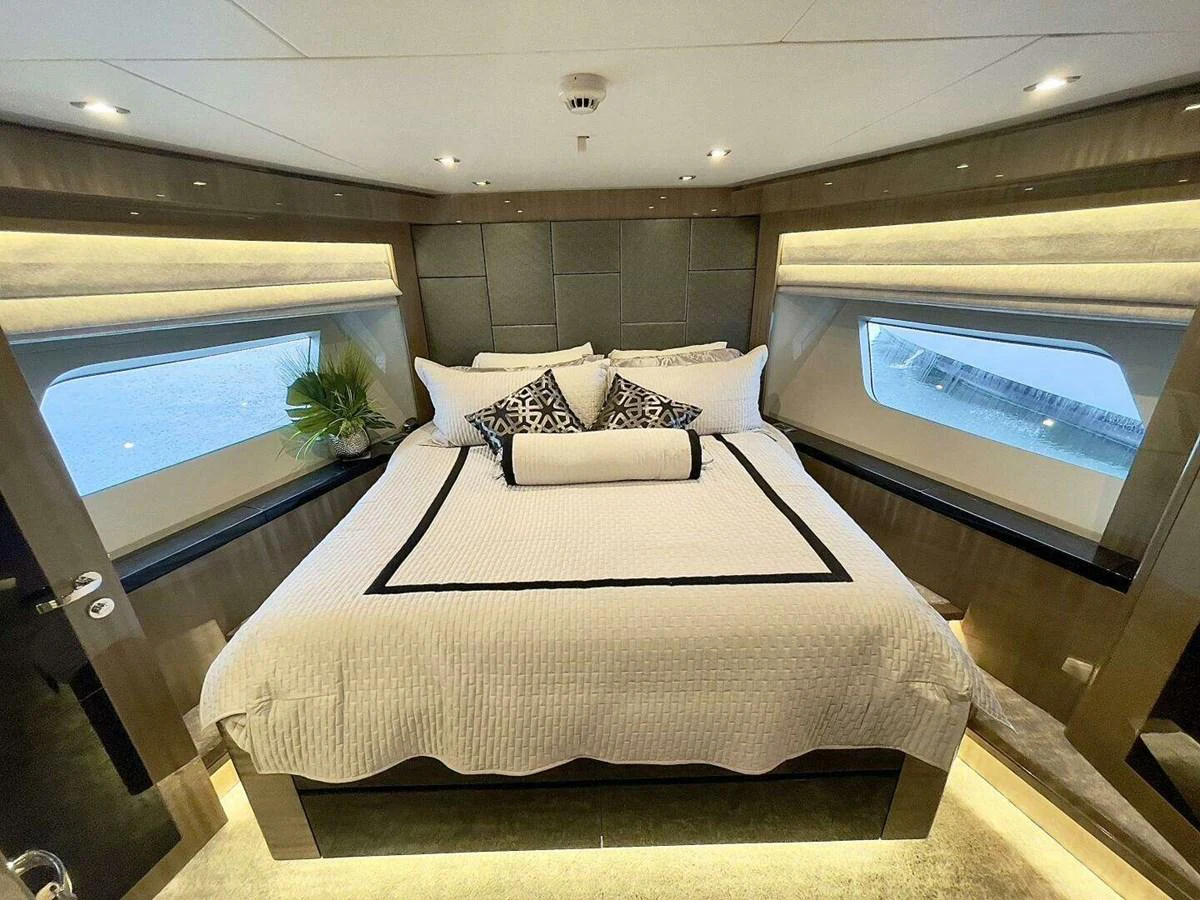 a bed in a room aboard SCORPIO II Yacht for Sale