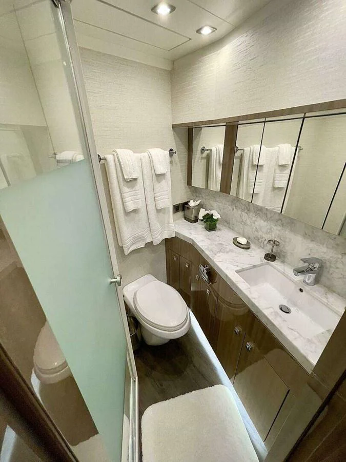 a bathroom with a sink and a toilet aboard SCORPIO II Yacht for Sale