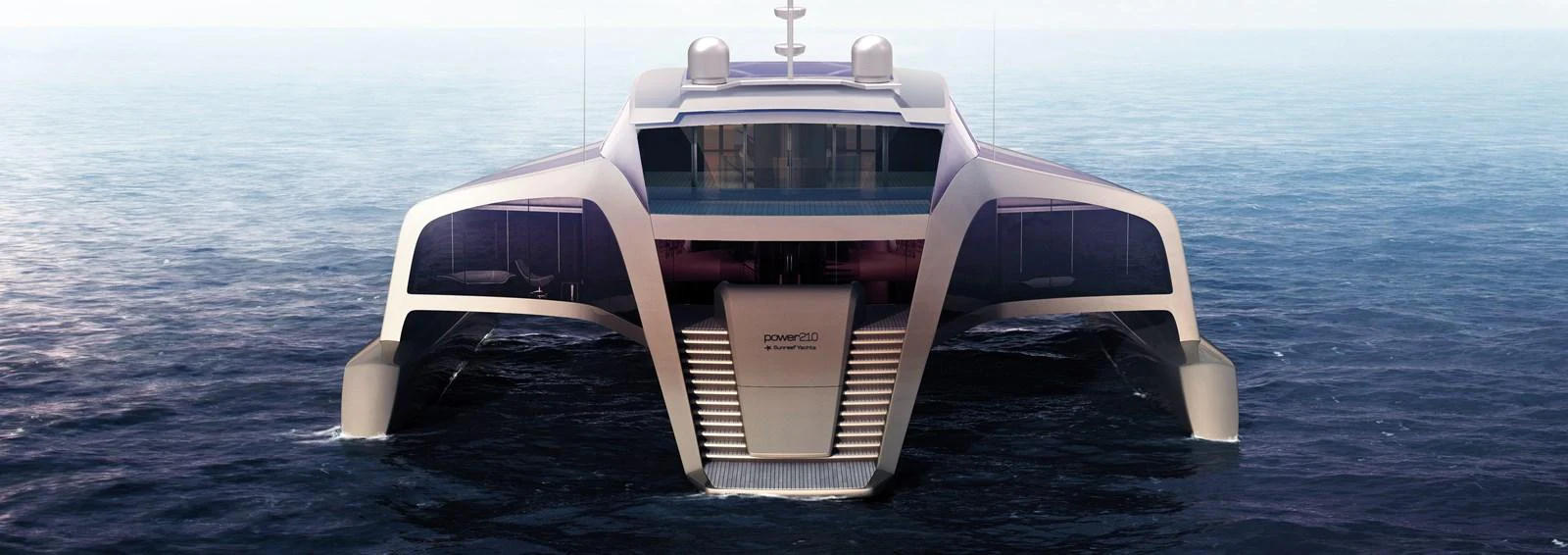A modern yacht with a sleek design is seen from the rear, showcasing its expansive deck and innovative structure. aboard 210 SUNREEF POWER TRIMARAN Yacht for Sale