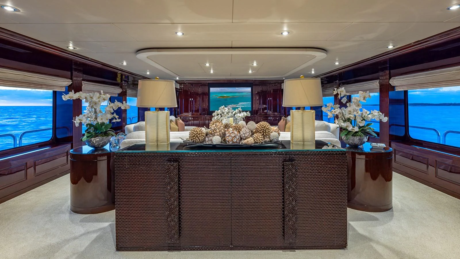 a room with a table and a large window aboard LADY JOY Yacht for Sale