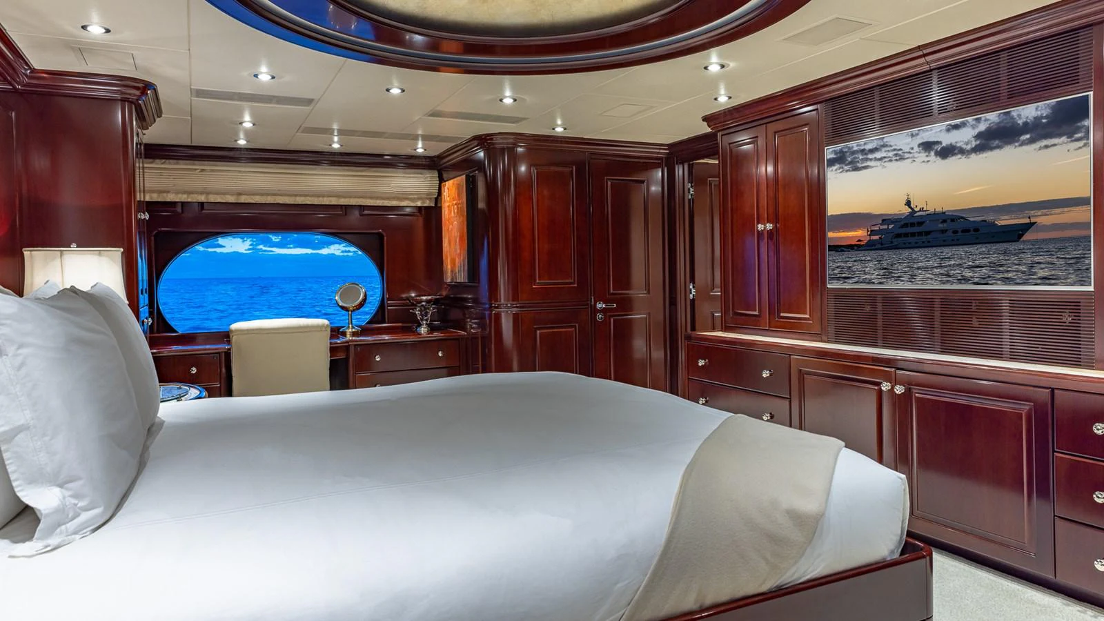 a room with a bed and a window aboard LADY JOY Yacht for Sale