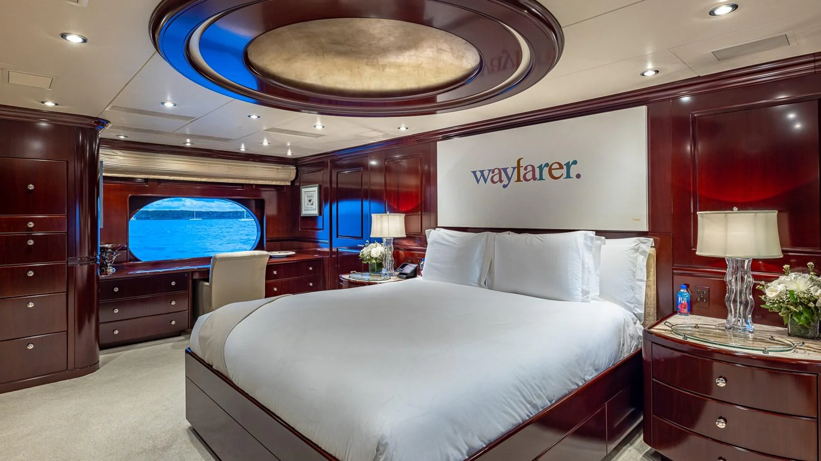 a room with a bed and a television aboard LADY JOY Yacht for Sale