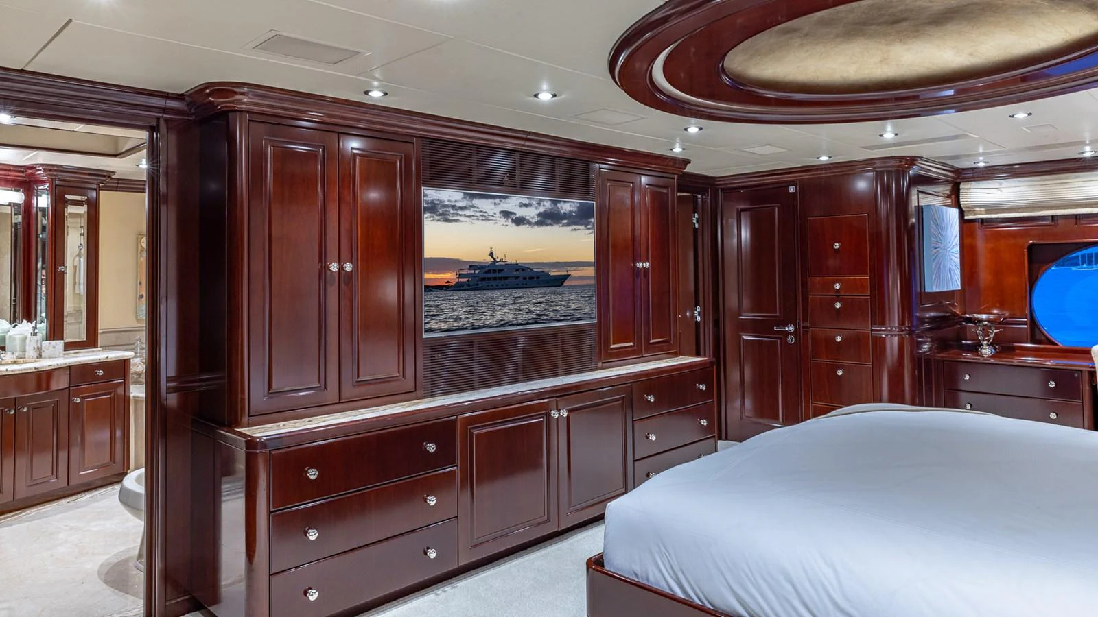 a bedroom with a large bed aboard LADY JOY Yacht for Sale