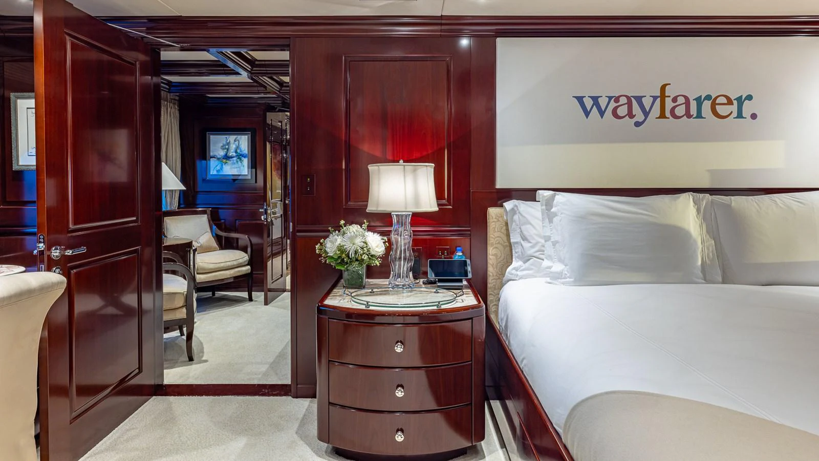 a room with a bed and a desk aboard LADY JOY Yacht for Sale