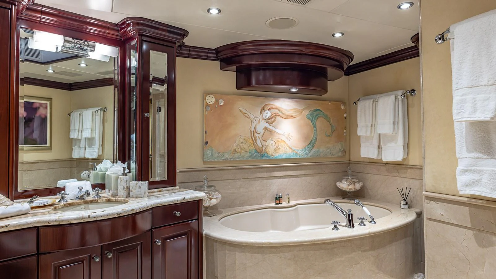 a bathroom with a large mirror aboard LADY JOY Yacht for Sale