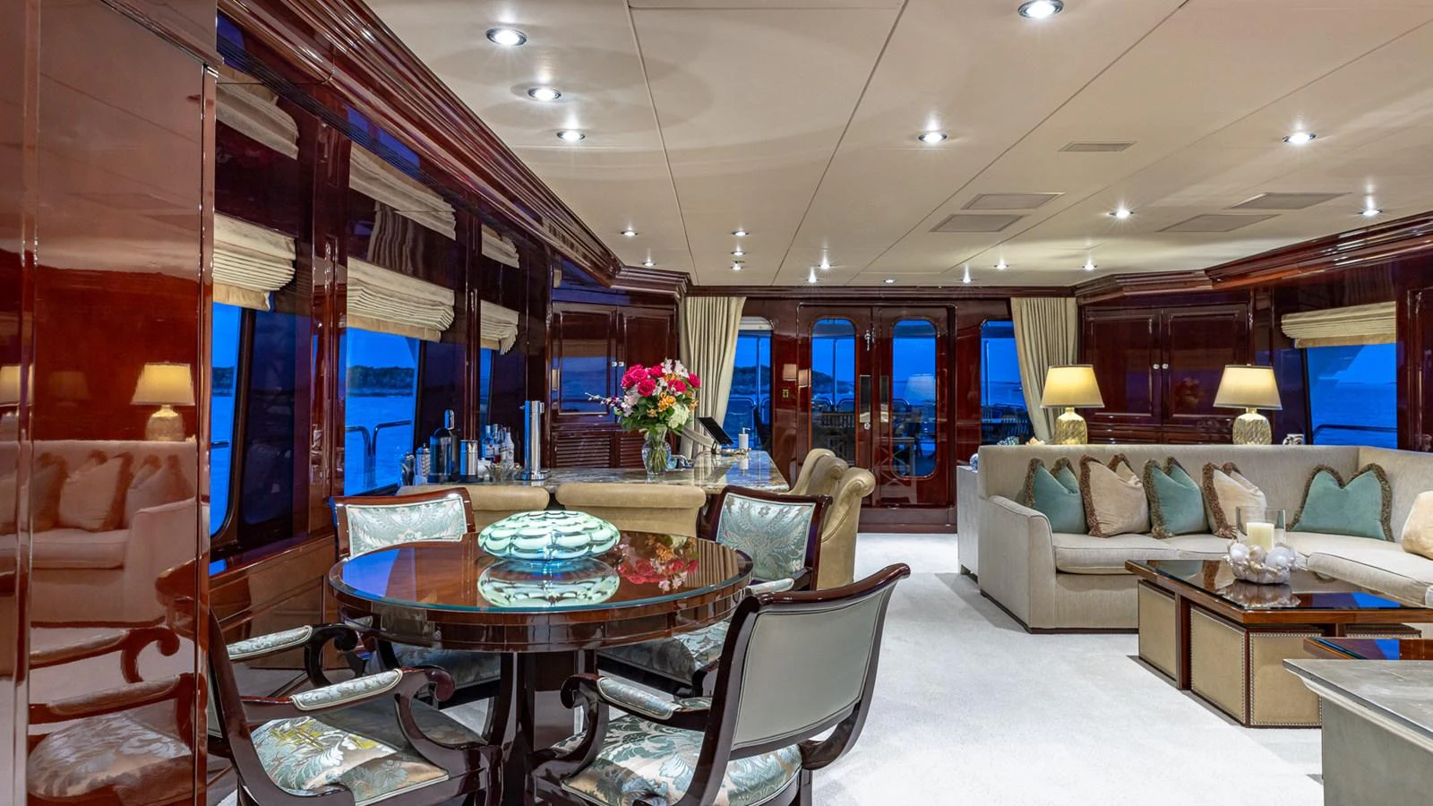 a living room with a table and chairs aboard LADY JOY Yacht for Sale