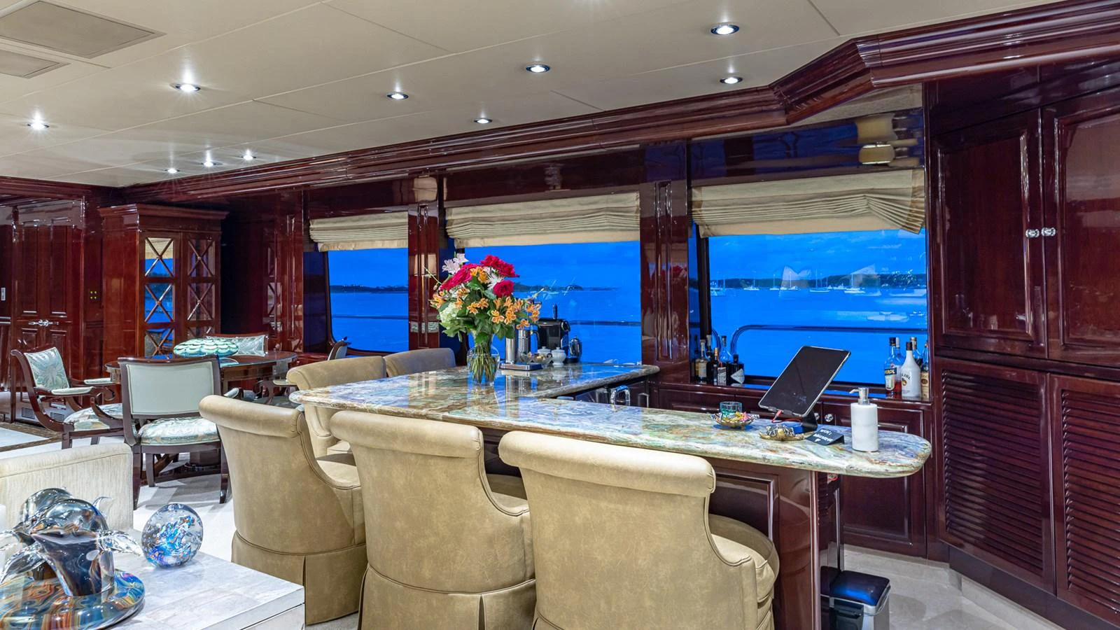 a large room with a table and chairs aboard LADY JOY Yacht for Sale