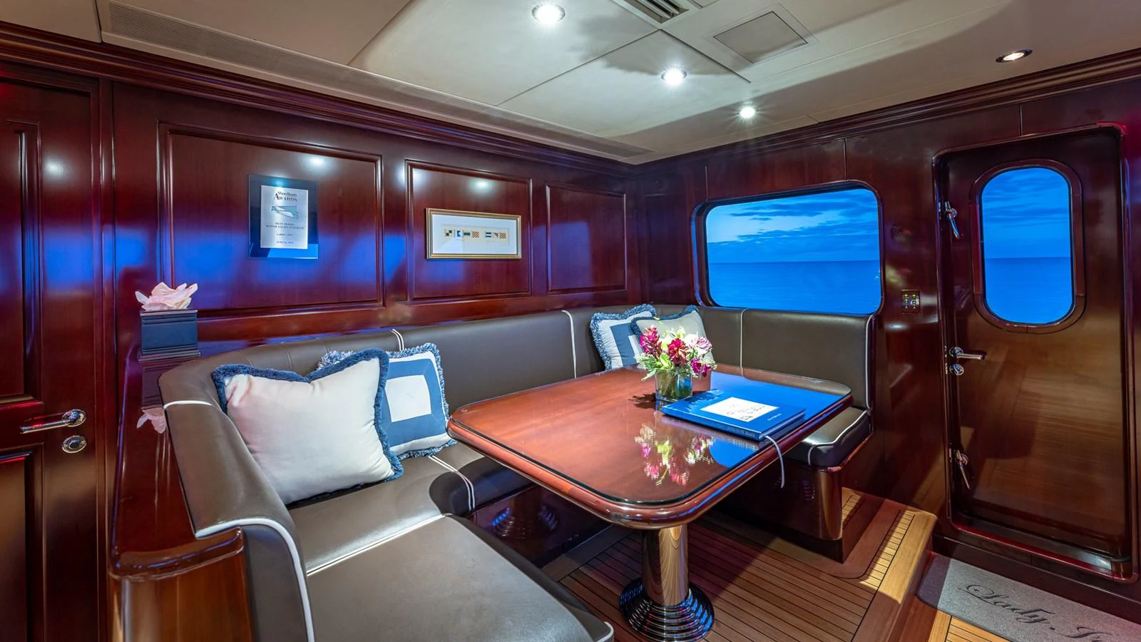 a room with a table and chairs aboard LADY JOY Yacht for Sale