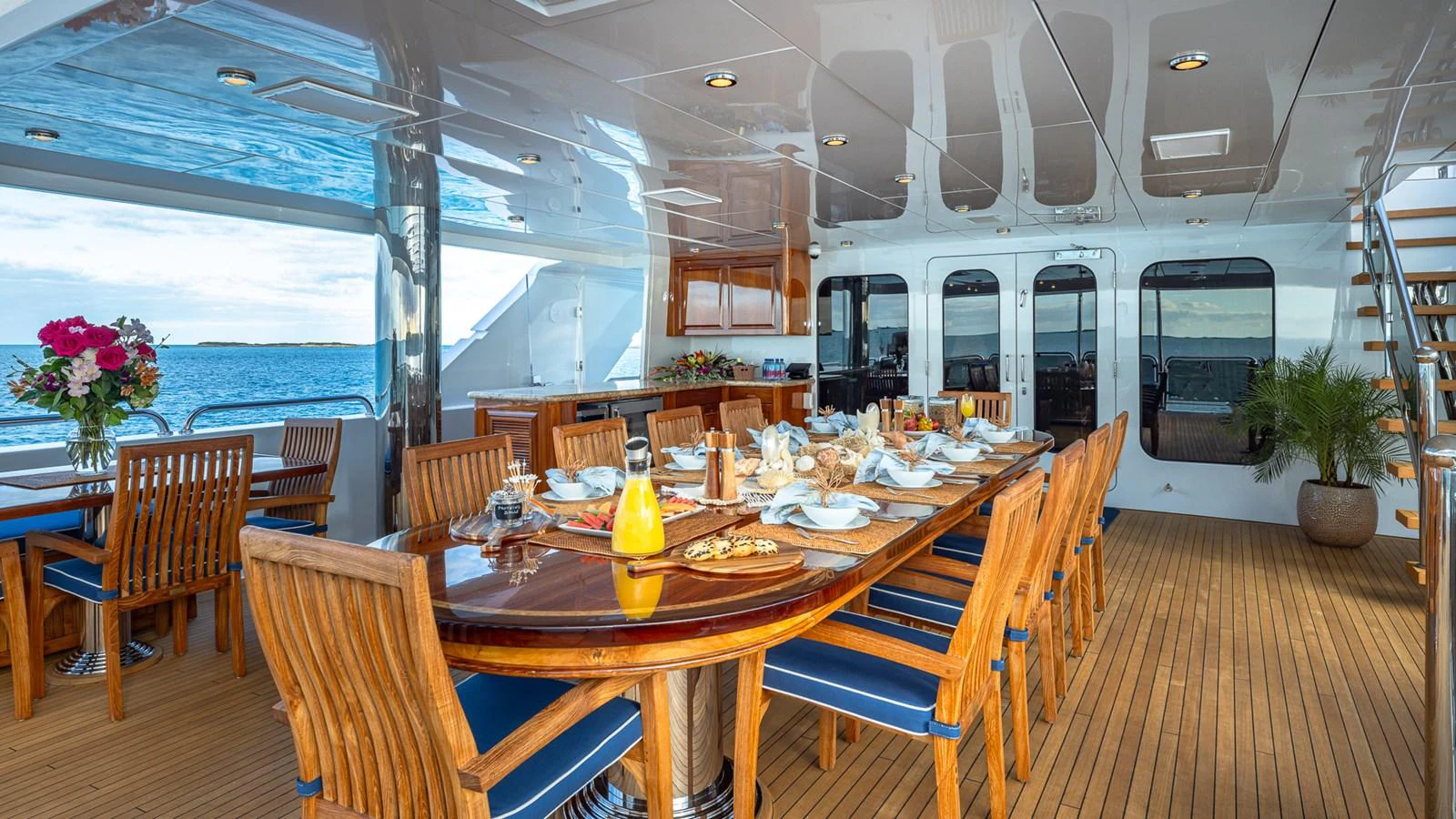 a dining room with a table and chairs aboard LADY JOY Yacht for Sale