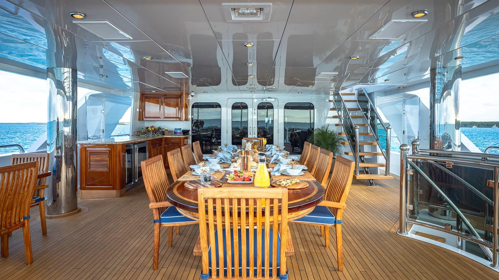 a dining room with a large window aboard LADY JOY Yacht for Sale