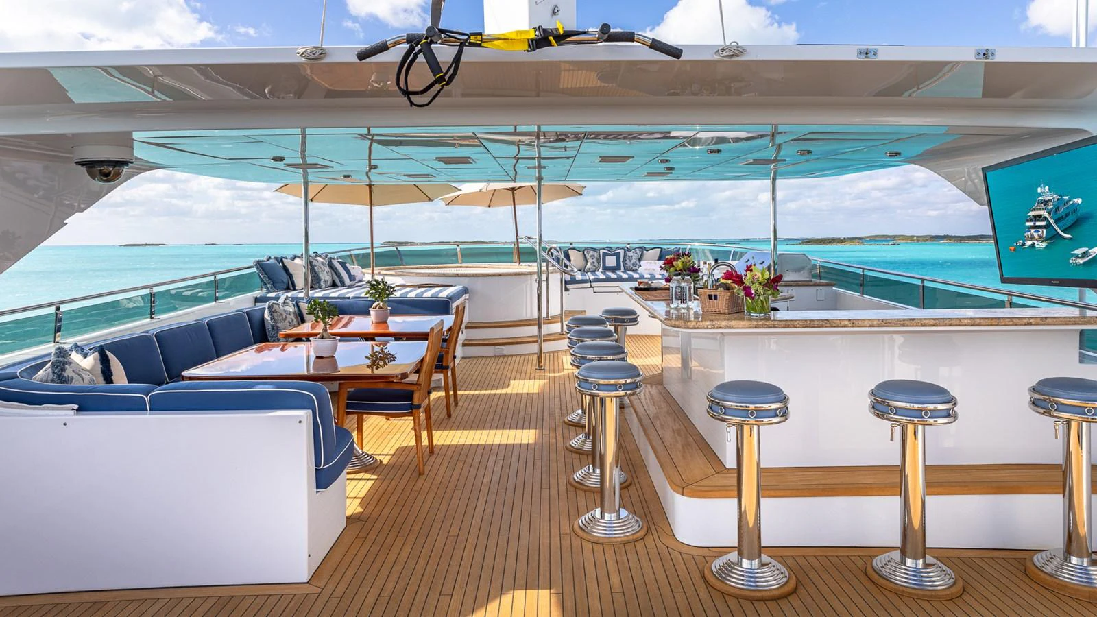 a room with a table chairs and a large window aboard LADY JOY Yacht for Sale