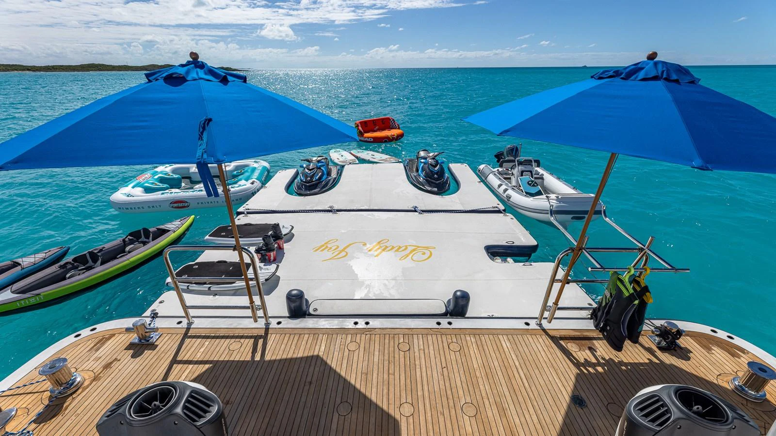 a group of boats sit on a dock aboard LADY JOY Yacht for Sale
