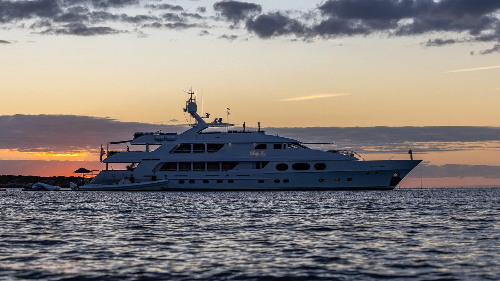 a large ship in the water aboard LADY JOY Yacht for Sale