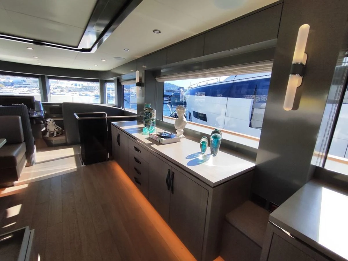 a large room with a table and chairs aboard ARGA Yacht for Sale