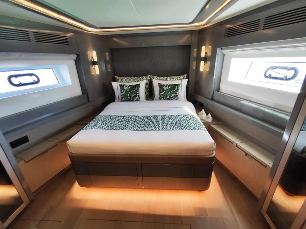 a room with a bed and a chair aboard ARGA Yacht for Sale