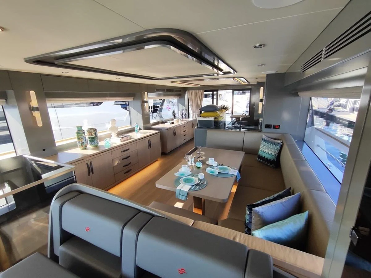 a room with a table chairs and a large window aboard ARGA Yacht for Sale