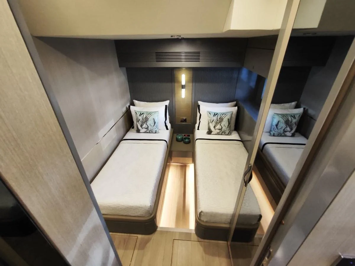 a room with a bed and a lamp aboard ARGA Yacht for Sale
