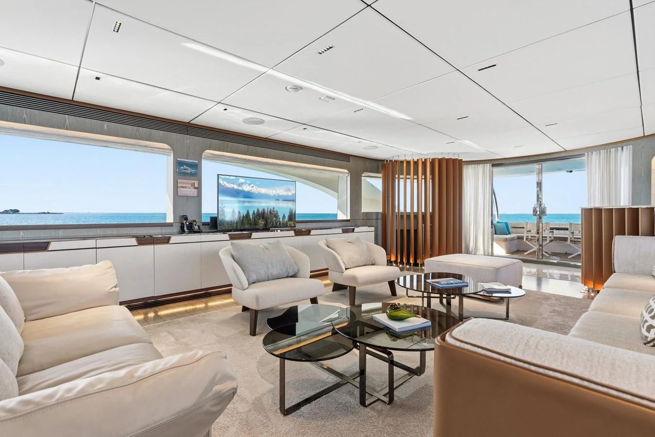 a living room with a large screen aboard WILD DUCK Yacht for Sale