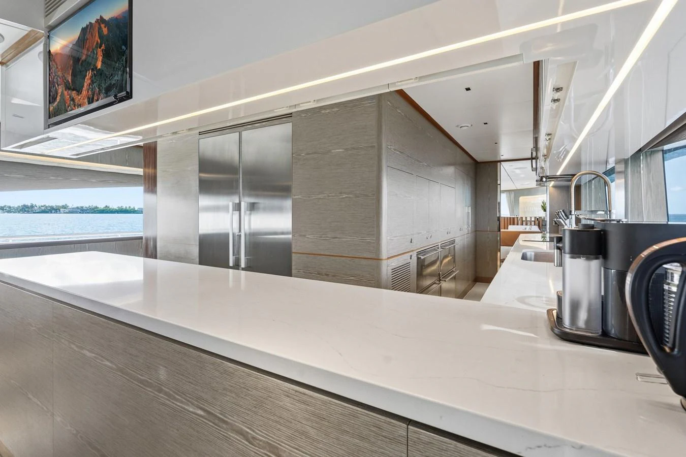 a large kitchen with a large glass wall aboard WILD DUCK Yacht for Sale