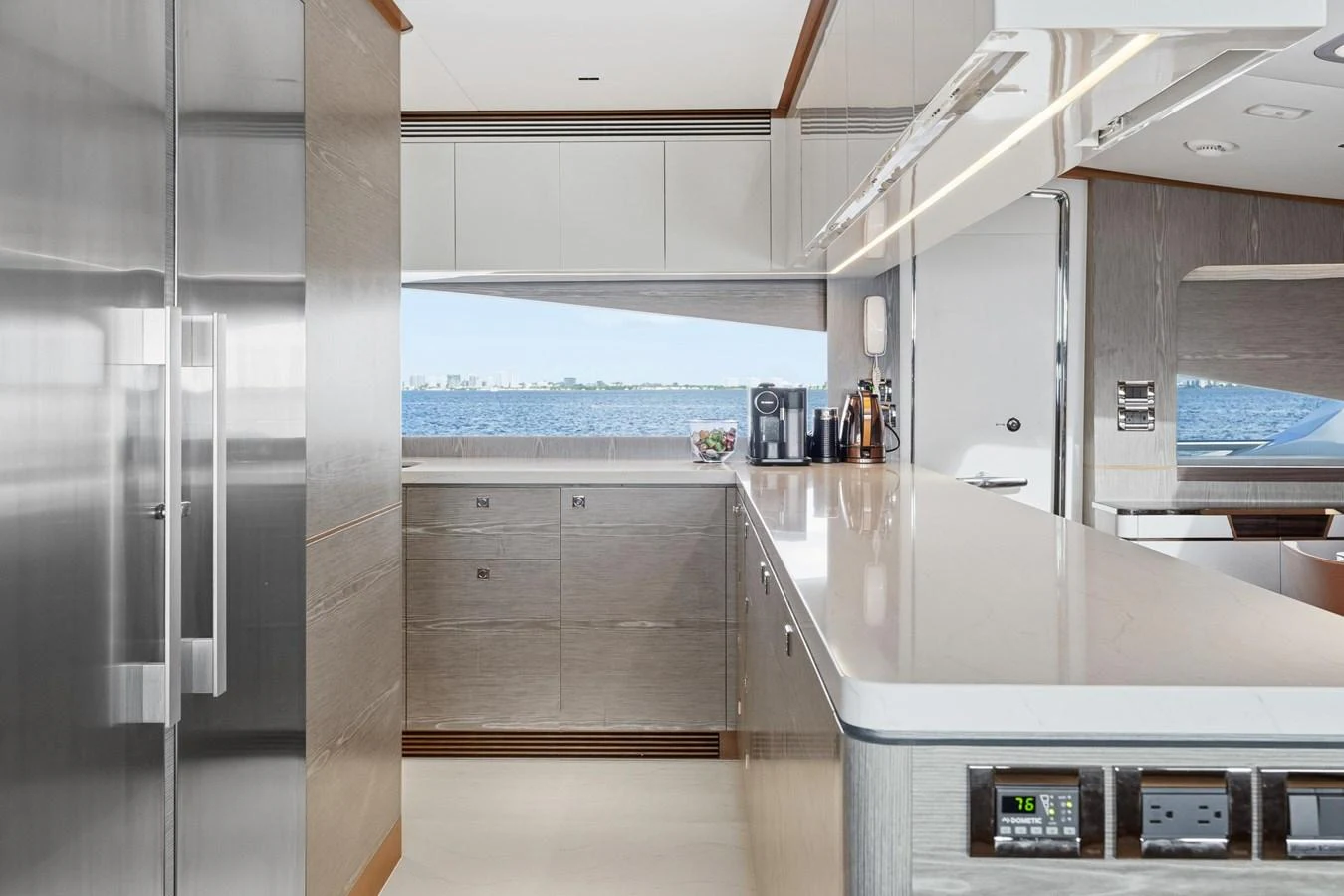 a kitchen with white cabinets aboard WILD DUCK Yacht for Sale