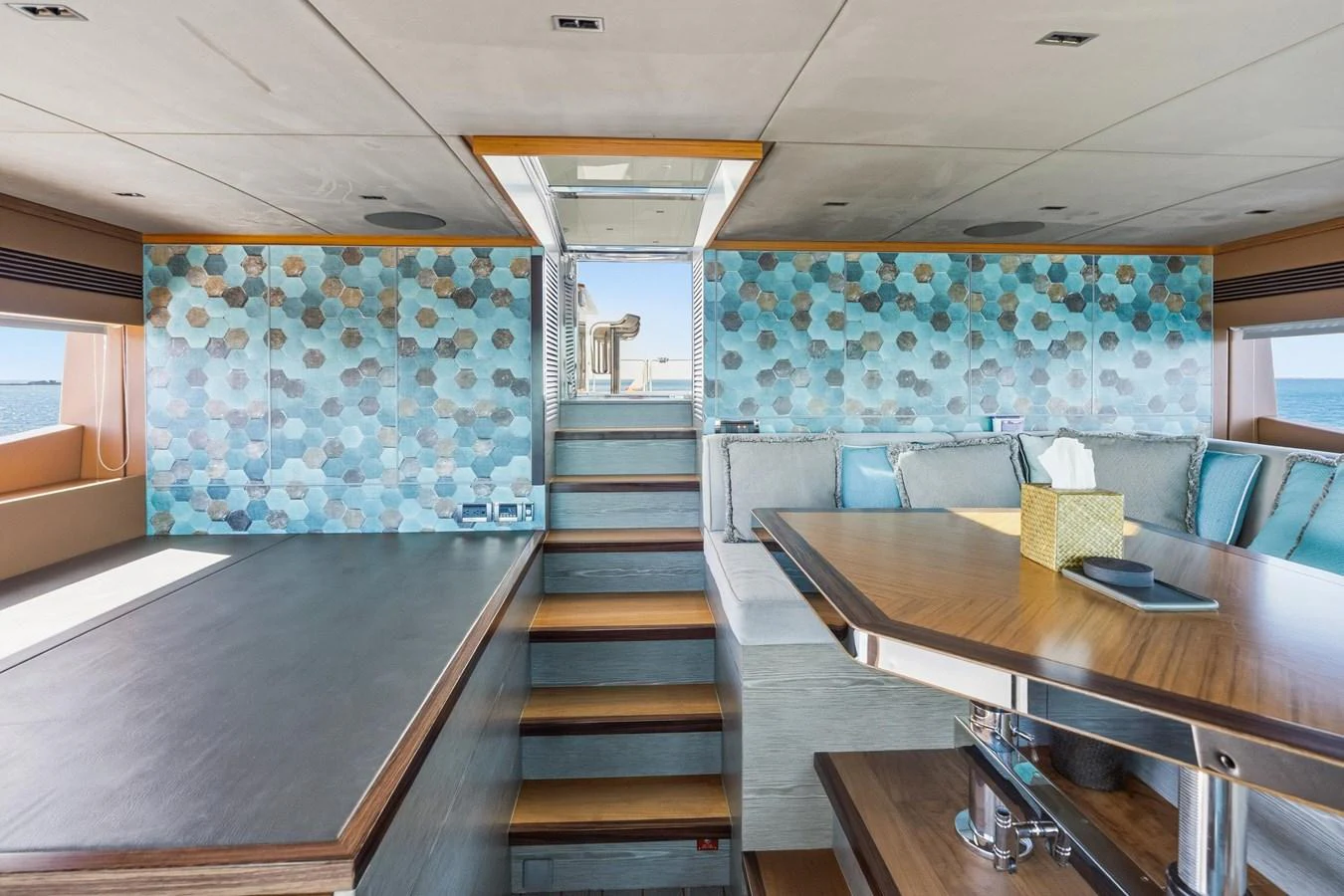 a room with a table and chairs aboard WILD DUCK Yacht for Sale