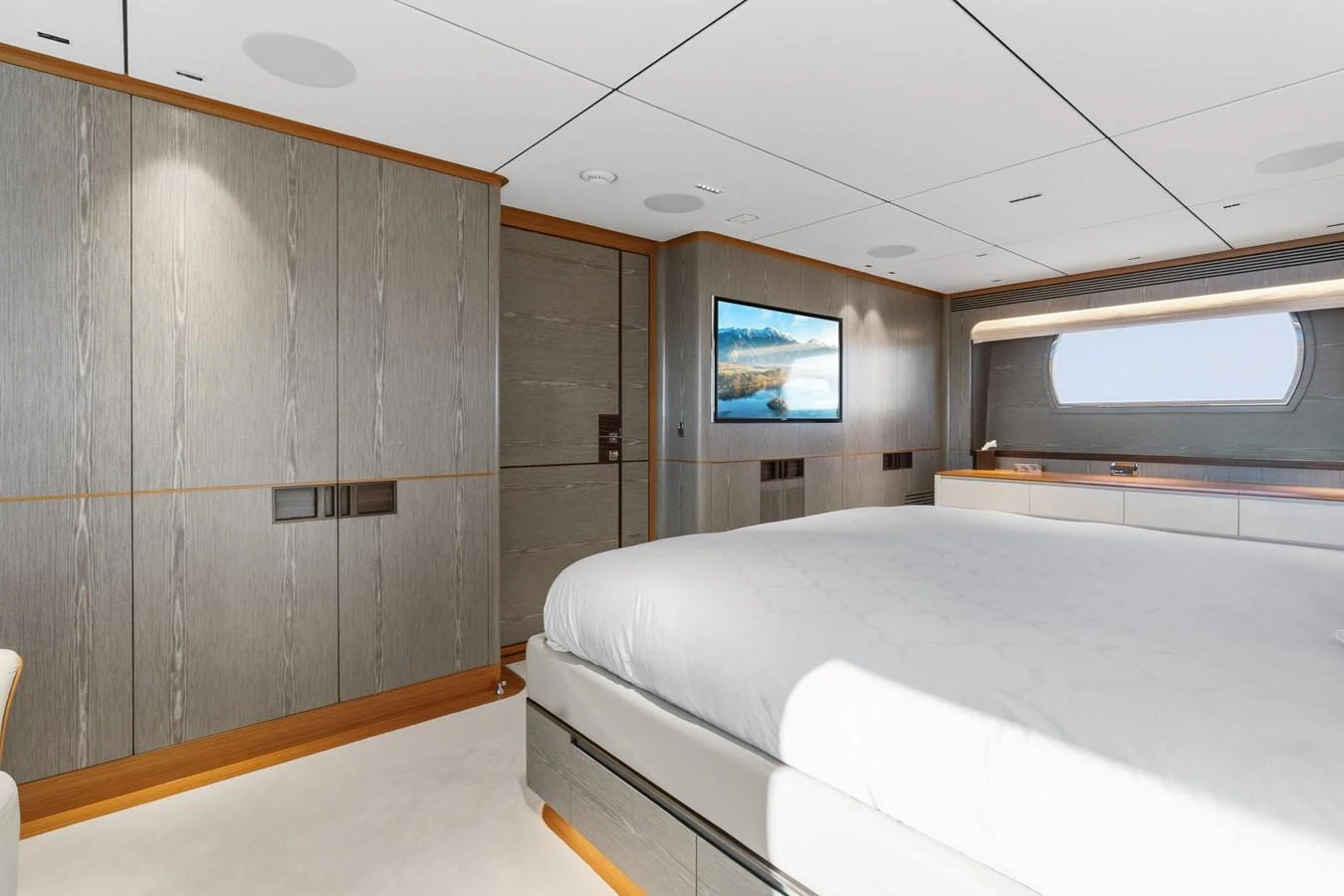 a room with a bed and a television aboard WILD DUCK Yacht for Sale