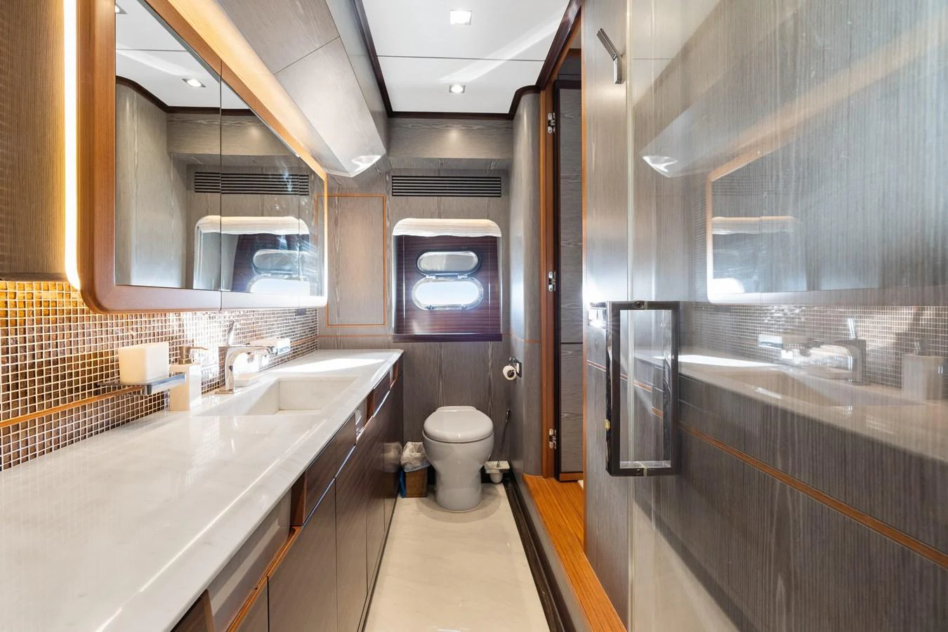 a bathroom with a tub sink and toilet aboard WILD DUCK Yacht for Sale