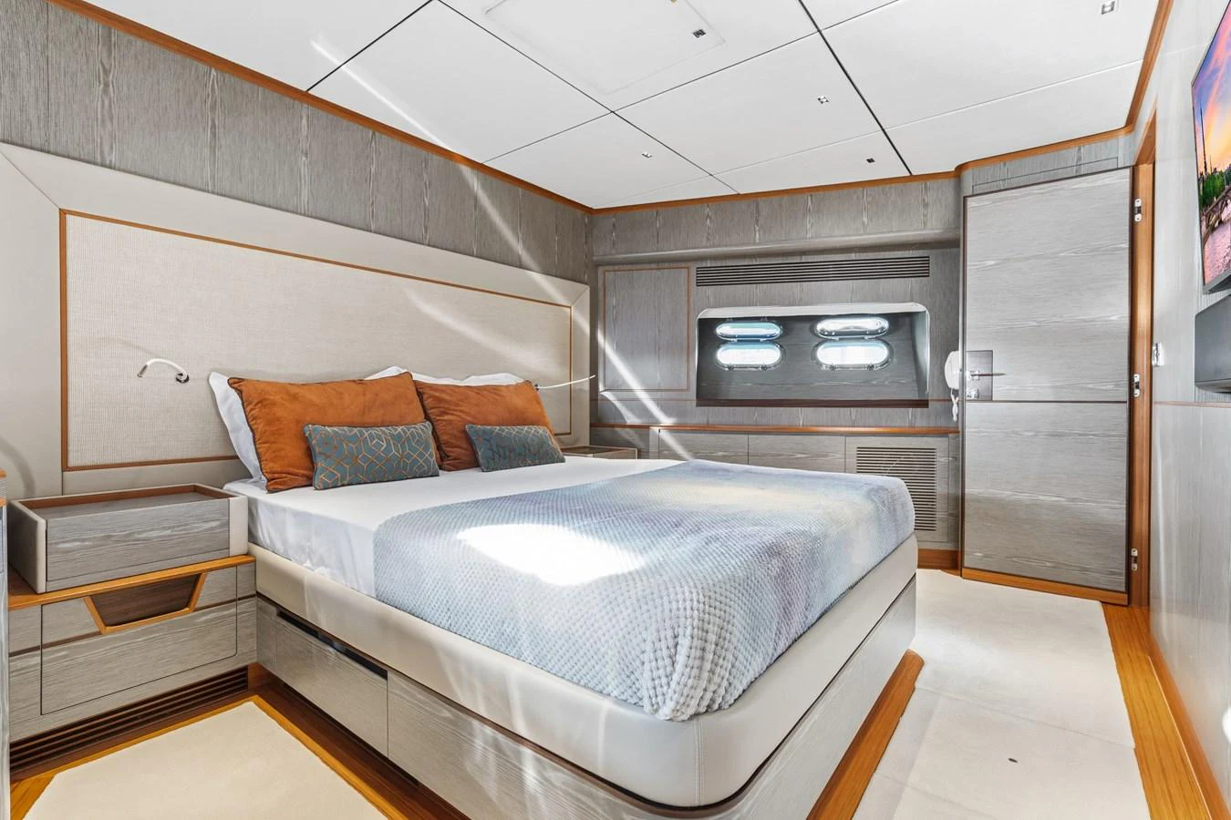a room with a bed and a fireplace aboard WILD DUCK Yacht for Sale