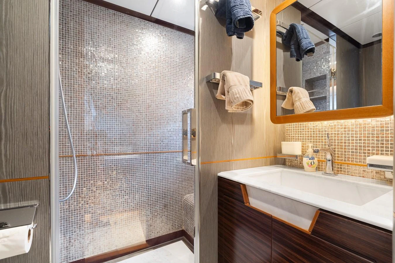 a bathroom with a glass shower aboard WILD DUCK Yacht for Sale