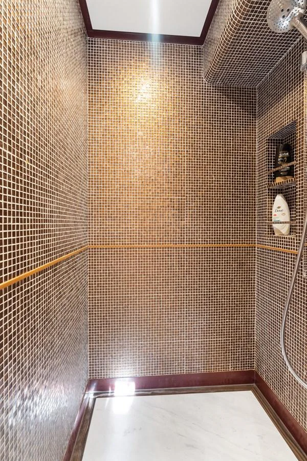 a tiled shower with a mirror aboard WILD DUCK Yacht for Sale