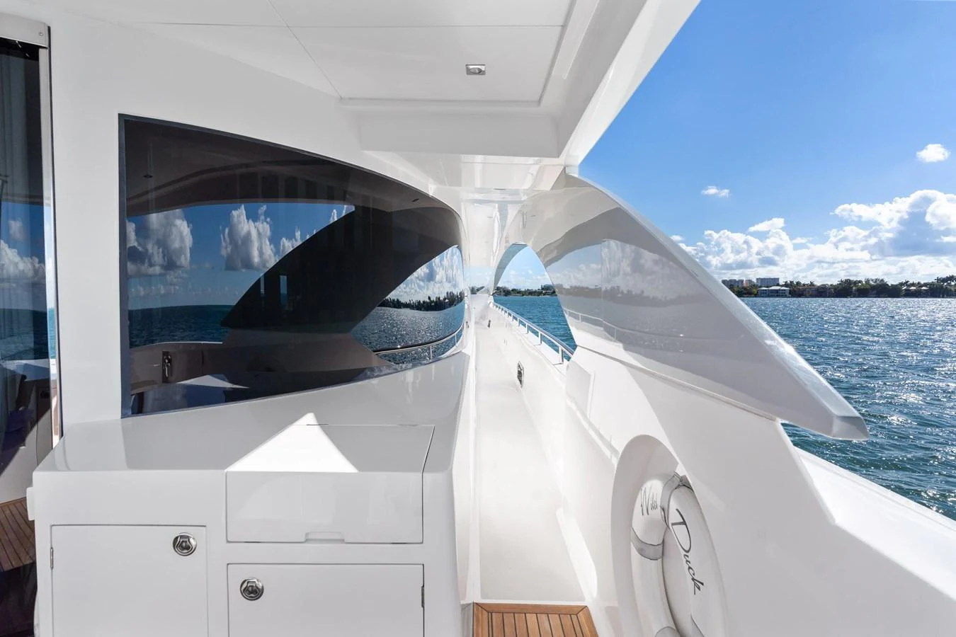 a boat with a large iceberg in the background aboard WILD DUCK Yacht for Sale