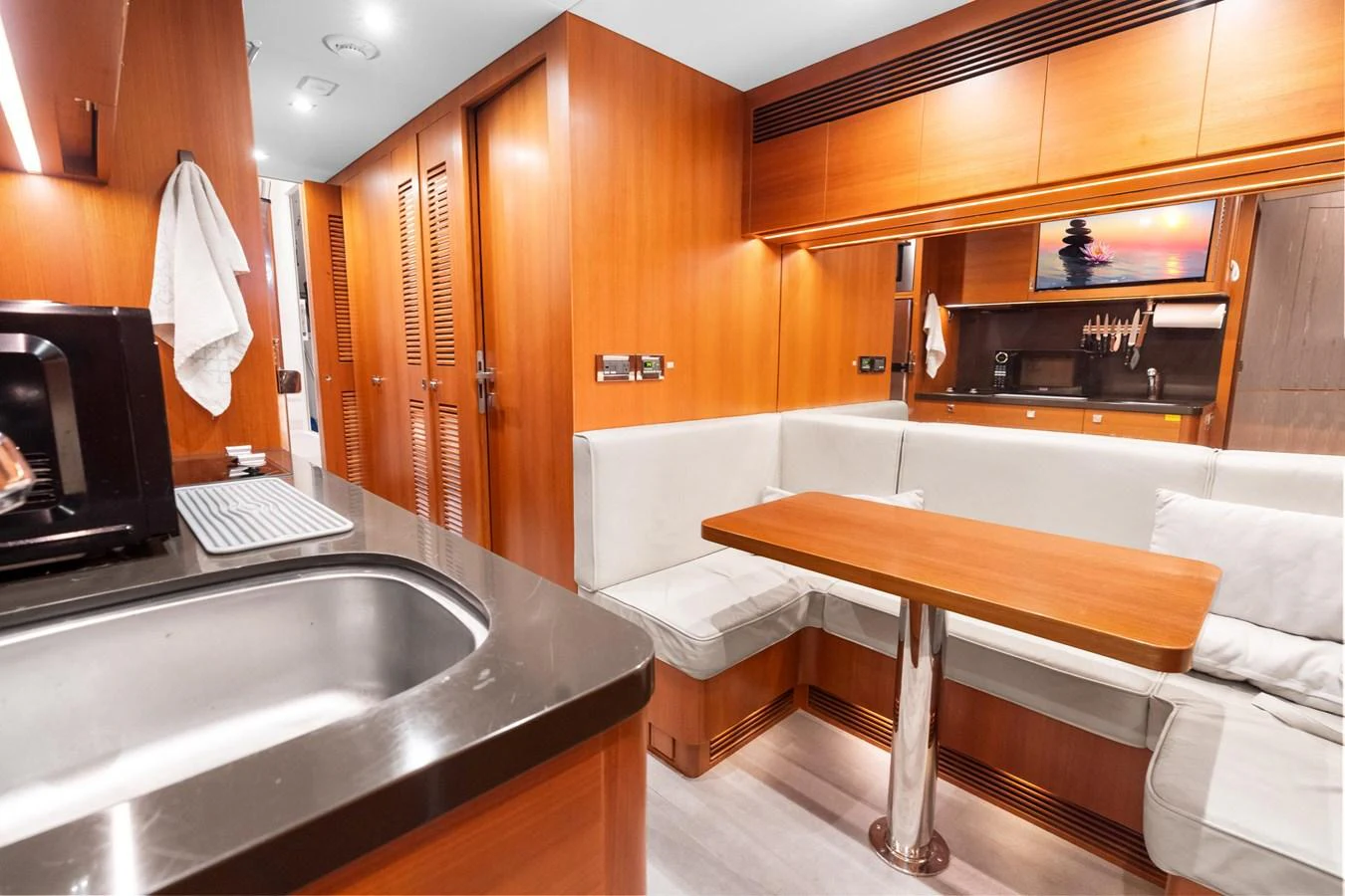 a kitchen with a sink and a table aboard WILD DUCK Yacht for Sale