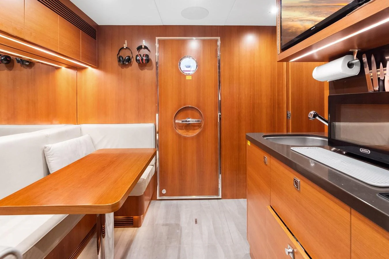 a kitchen with wooden cabinets aboard WILD DUCK Yacht for Sale