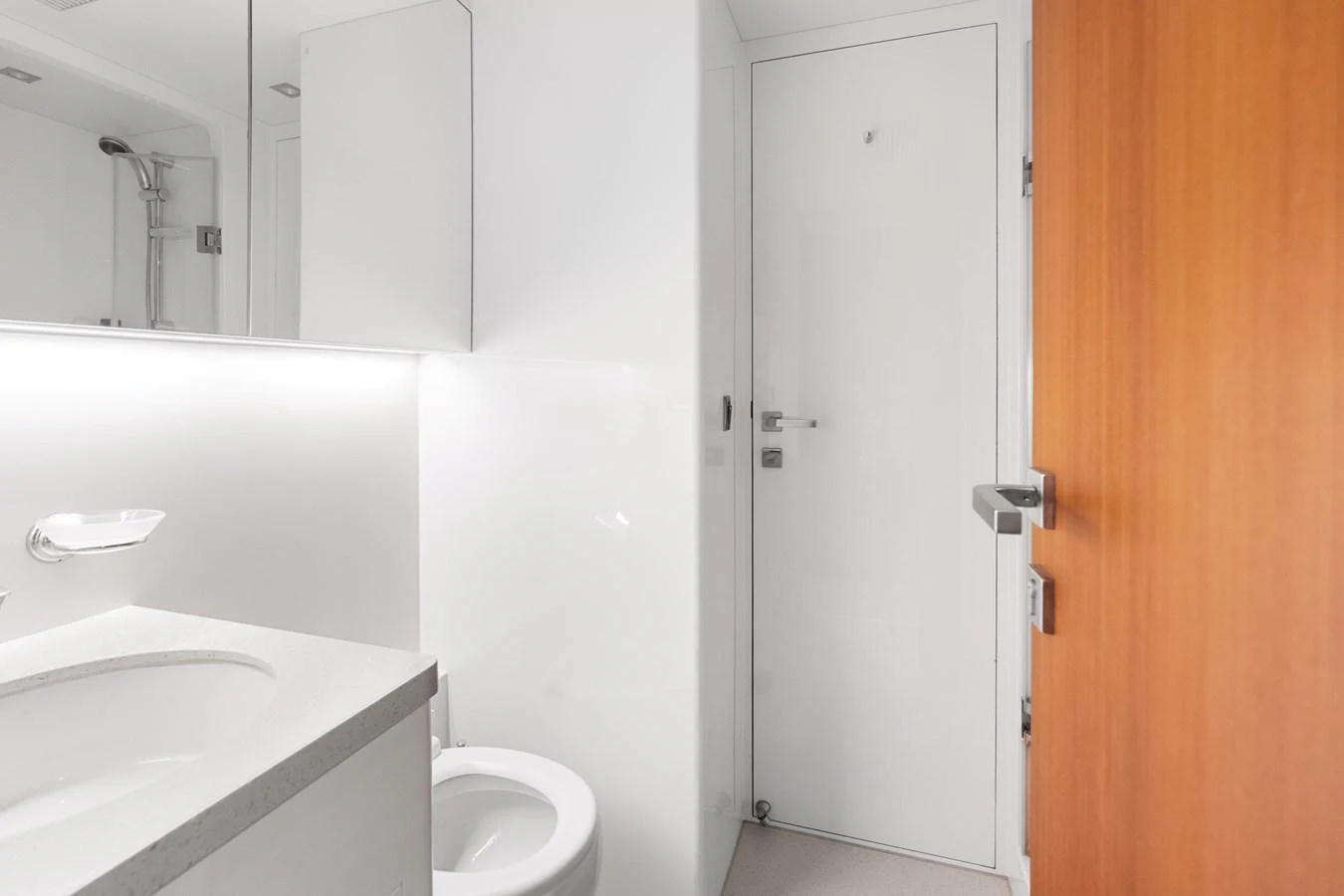 a bathroom with a toilet and a sink aboard WILD DUCK Yacht for Sale