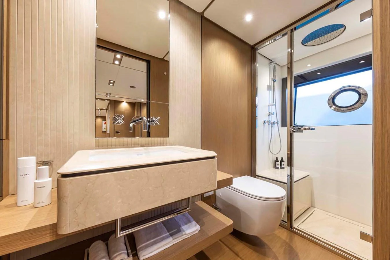 The yacht's bathroom features modern fixtures and a spacious shower area with elegant design elements. aboard EPIC Yacht for Sale