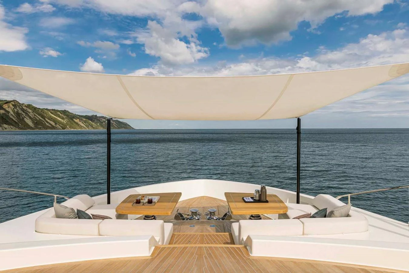 The sundeck offers a luxurious space with comfortable seating and stunning ocean views. aboard EPIC Yacht for Sale