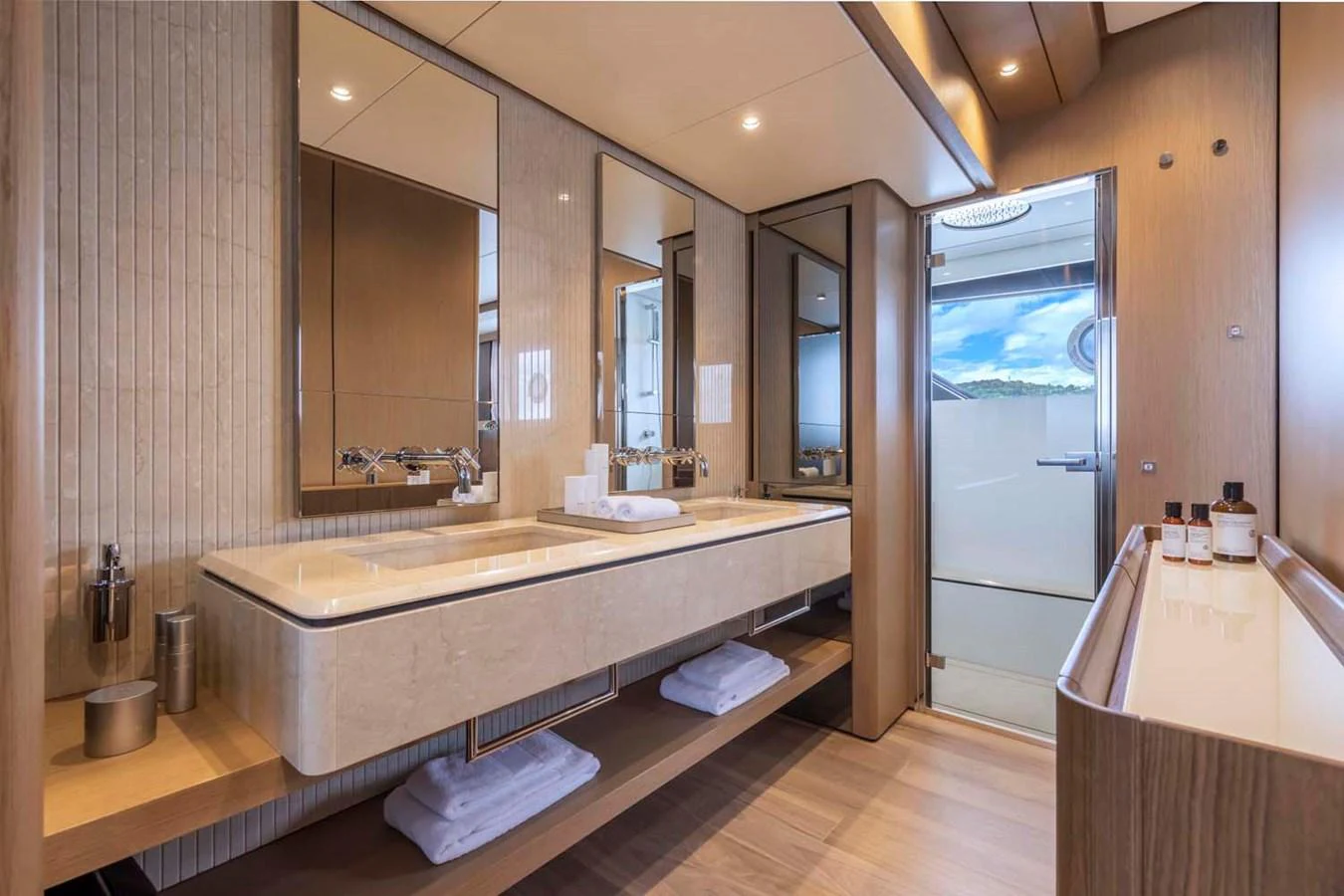 The yacht's bathroom features a sleek, modern design with ample counter space and luxurious amenities. aboard EPIC Yacht for Sale