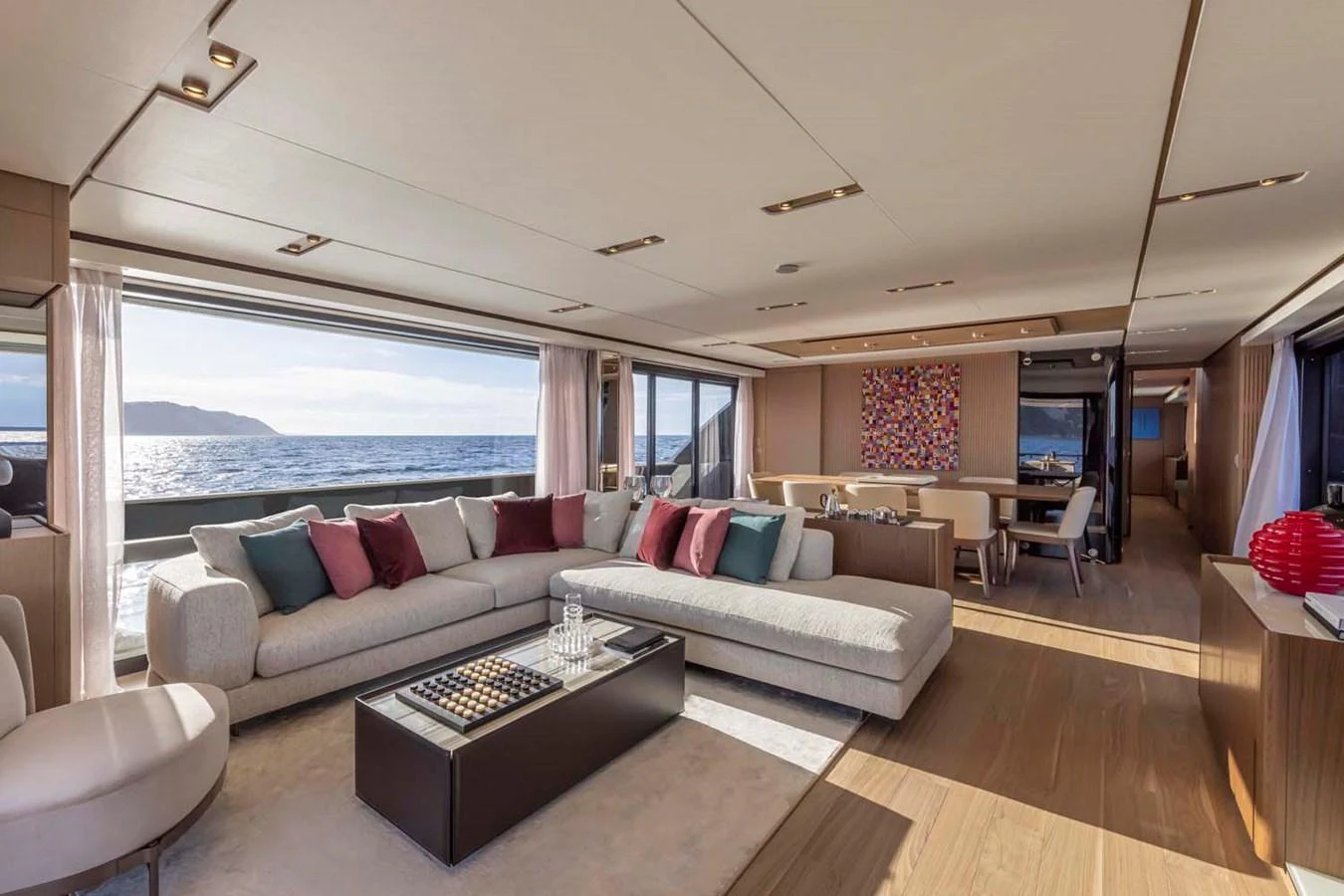 The spacious salon features elegant furnishings and panoramic ocean views. aboard EPIC Yacht for Sale