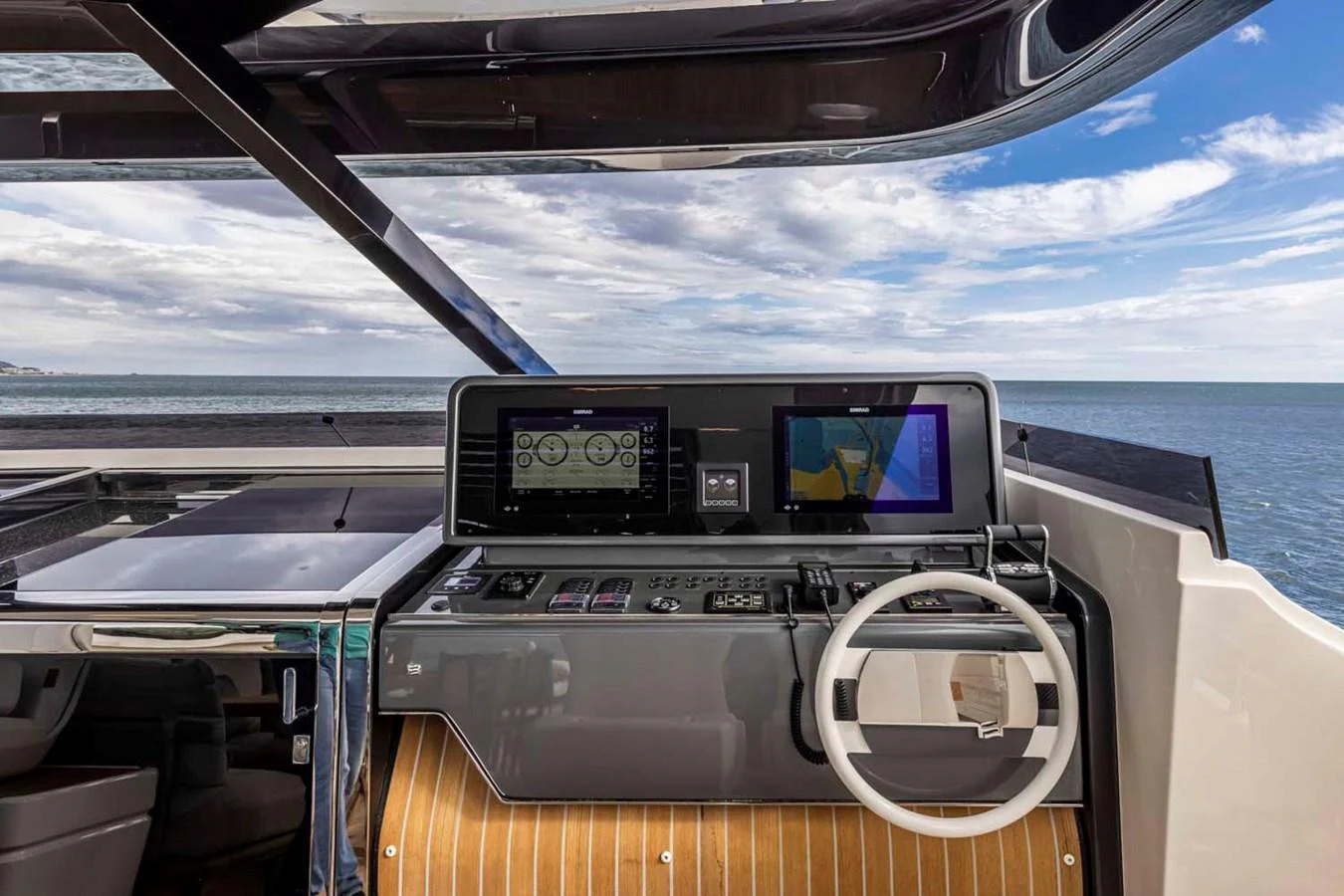 The helm station offers a modern and sleek design with advanced navigation equipment and a stunning sea view. aboard EPIC Yacht for Sale
