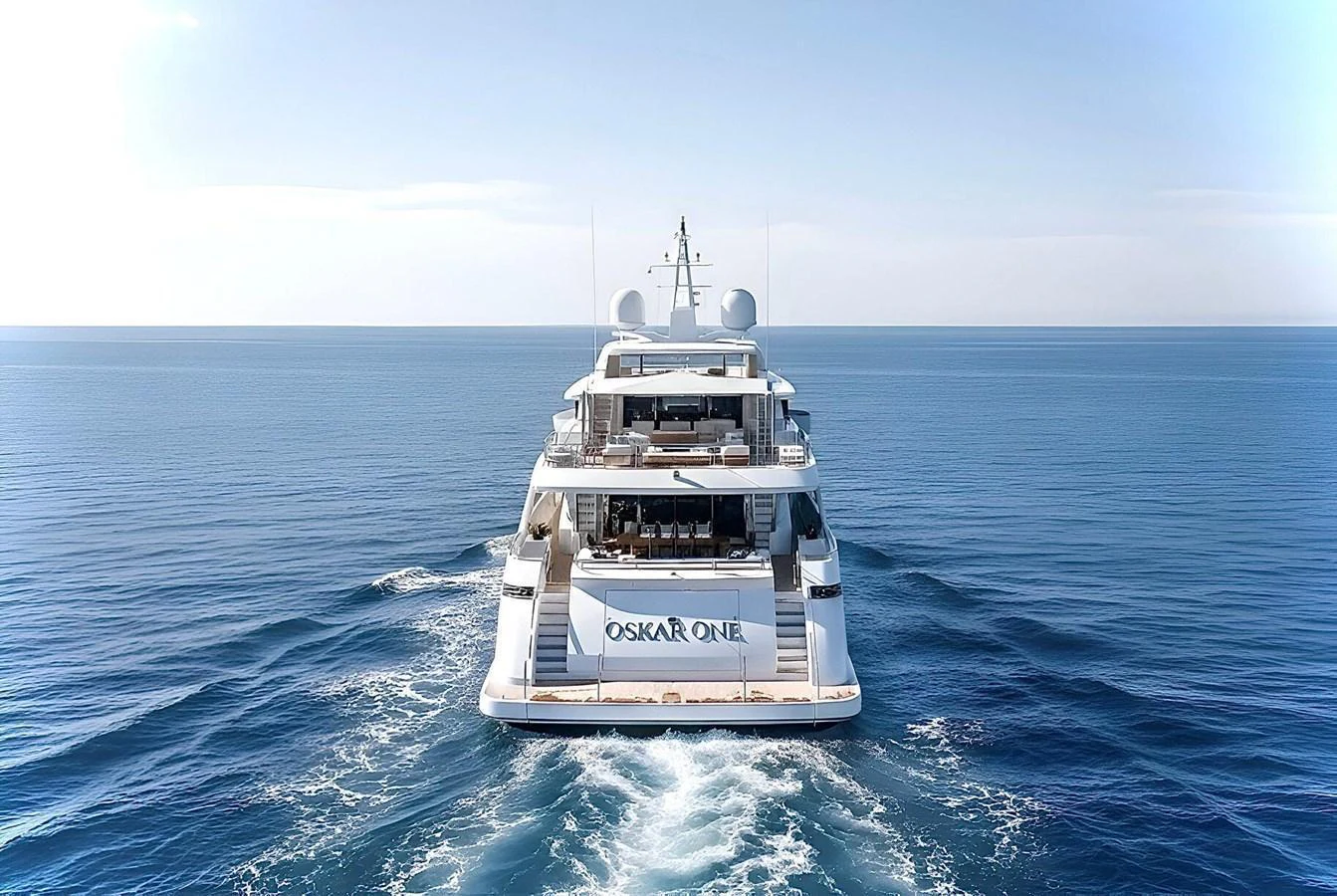 A luxurious yacht sails smoothly on the open sea, showcasing its elegant design and spacious decks. aboard OSKAR ONE Yacht for Sale