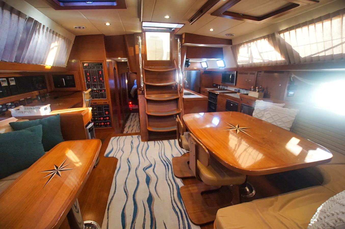 The yacht's salon features a warm and inviting atmosphere with ample seating and natural light. aboard RAGNAR Yacht for Sale