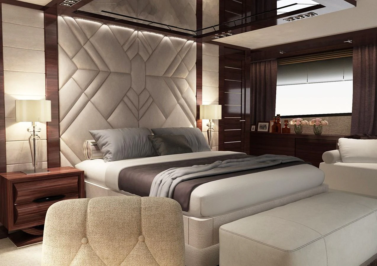 a room with a bed and a couch aboard BRIZO 110 EXPLORER Yacht for Sale