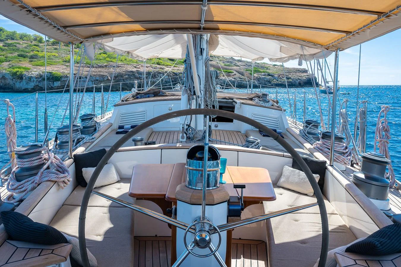 The yacht's cockpit offers a spacious and comfortable area for relaxation and navigation, with a stunning view of the surrounding waters. aboard TEMPEST Yacht for Sale