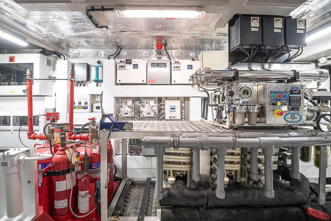 The image showcases the yacht's well-equipped engine room with advanced machinery and safety equipment. aboard THIS TIME NEXT YEAR Yacht for Sale