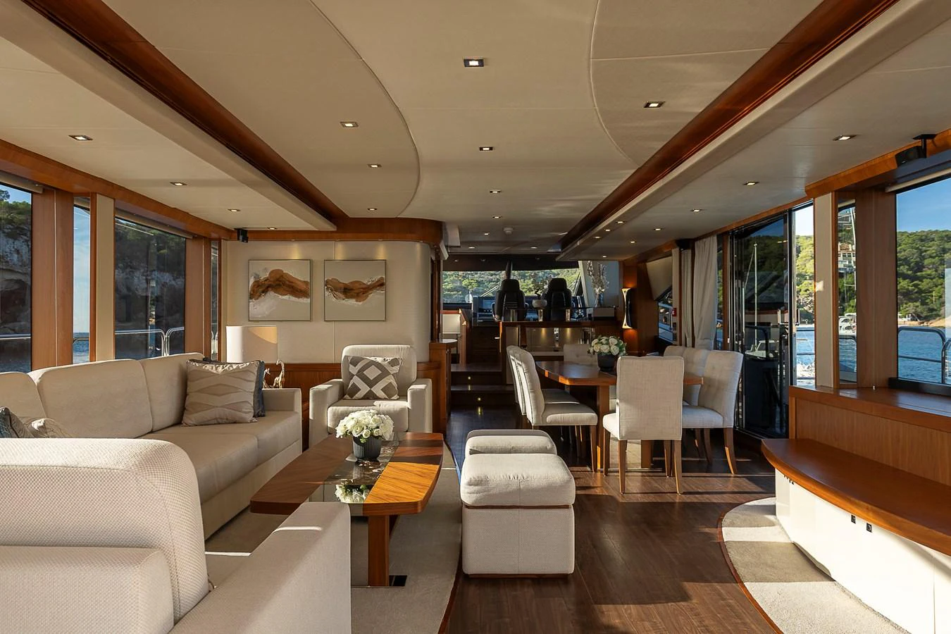The yacht's salon offers a spacious and elegantly designed living area with ample natural light and luxurious furnishings. aboard THIS TIME NEXT YEAR Yacht for Sale